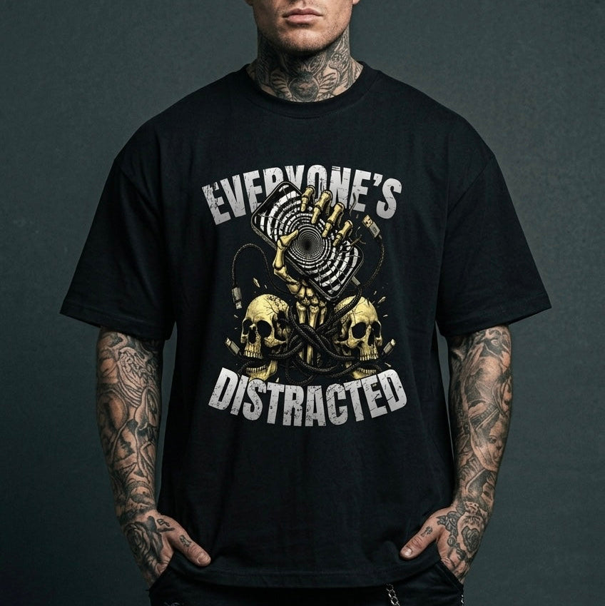 Man wearing a black t-shirt with graphic design and text against a dark background