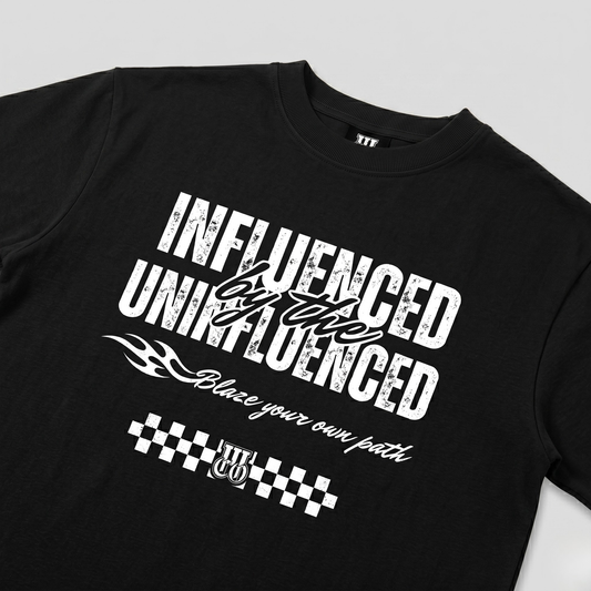 Black t-shirt with white text and graphics on a light gray background