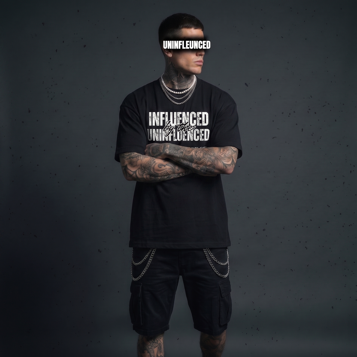 Person wearing a black t-shirt with 'INFLUENCED' text on a dark background