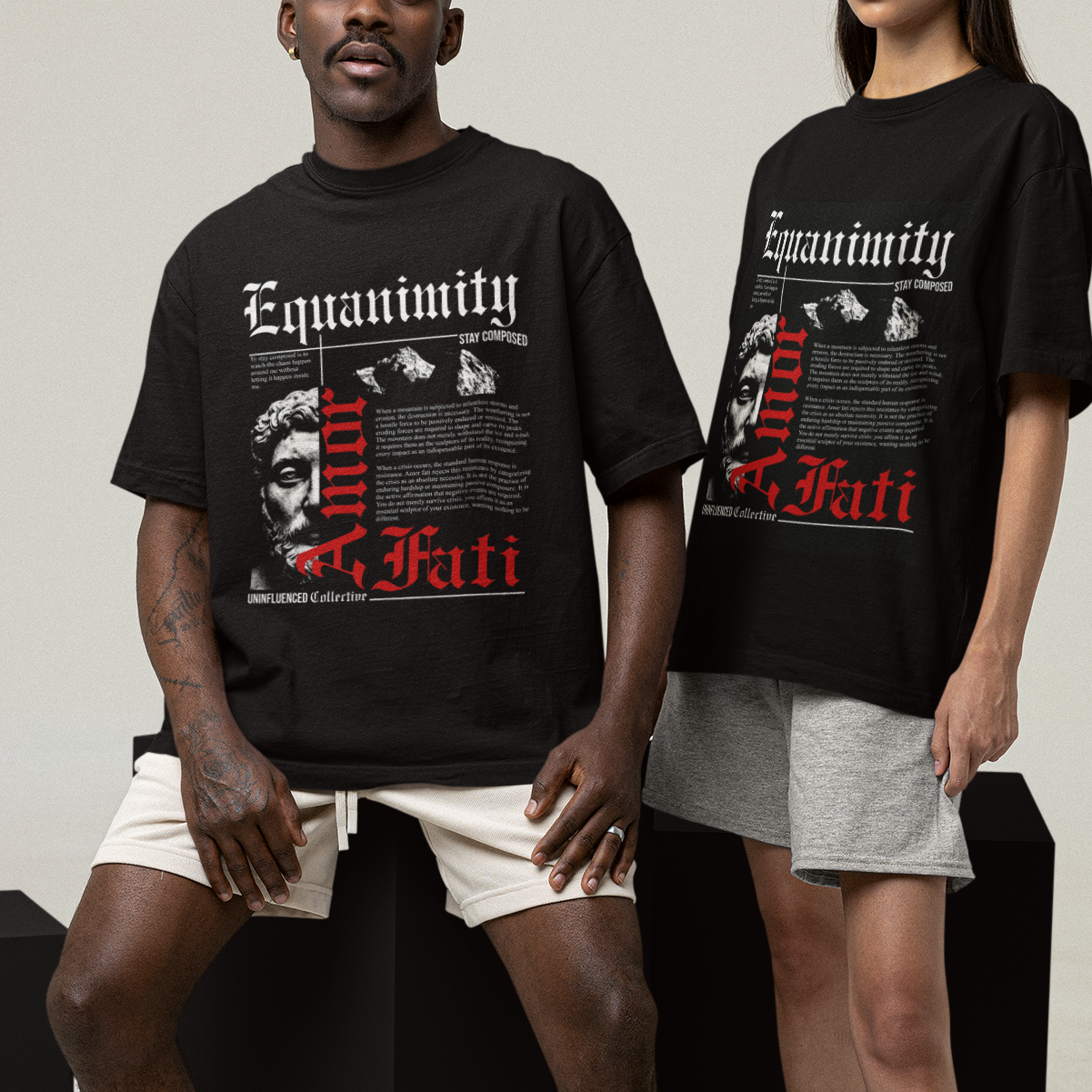 Two people wearing black t-shirts with text and graphics on a white background