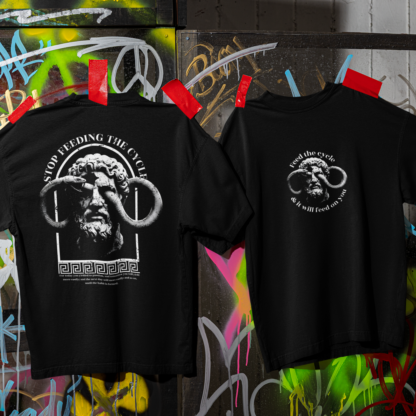 Two black t-shirts with graphic designs on a colorful graffiti background